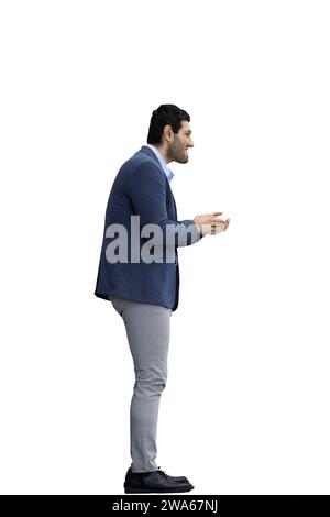 A man in a jacket on a White background rubs his hands. In profile Stock Photo