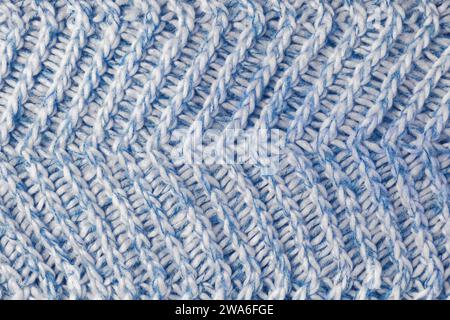 Jersey textile background , blue white melange knitted wool fabric. Woolen knitwear, sweater, pullover surface texture, textile structure, cloth surfa Stock Photo