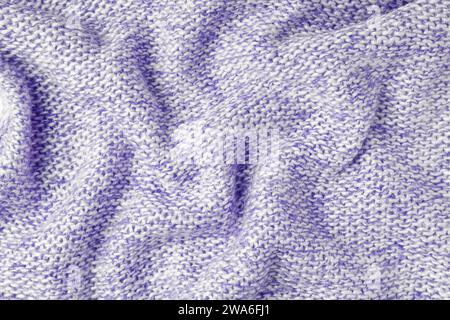 Purple and white color melange knitting cashmere wool cloth texture. Background of crumpled, wrinkled knit fabric,  textile structure, cloth surface, Stock Photo