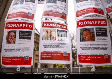 January 1, 2024, KrakÃ³w, Poland: Images of Israeli hostages kidnapped by Hamas are hanging on a gate of Jewish Community Centre in Krakow, Poland on January 1st, 2024. Around 240 people were taken captive by Hamas during the terror attack on Israel on October 7th 2023, with 105 prisoners later being released during a six-day ceasefire at the end of November. (Credit Image: © Beata Zawrzel/ZUMA Press Wire) EDITORIAL USAGE ONLY! Not for Commercial USAGE! Stock Photo