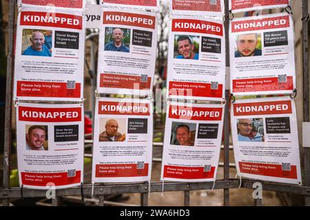 January 1, 2024, KrakÃ³w, Poland: Images of Israeli hostages kidnapped by Hamas are hanging on a gate of Jewish Community Centre in Krakow, Poland on January 1st, 2024. Around 240 people were taken captive by Hamas during the terror attack on Israel on October 7th 2023, with 105 prisoners later being released during a six-day ceasefire at the end of November. (Credit Image: © Beata Zawrzel/ZUMA Press Wire) EDITORIAL USAGE ONLY! Not for Commercial USAGE! Stock Photo