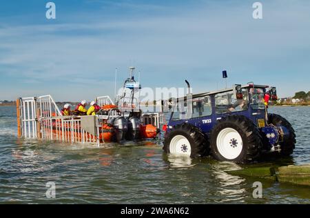 Mudeford Servant Atlantic 85 B Class Inshore Lifeboat Being Towed By A TW33 Tractor At Mudeford Lifeboat Station Stock Photo