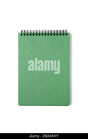 Open spiral bound notepad with craft green sheets, isolated on white background. Top view, copy space for text, template, mockup Stock Photo