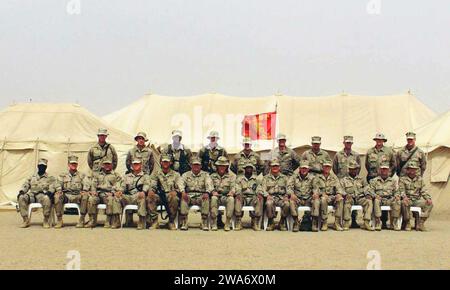 US military forces. US Marine Corps (USMC) Marines of the 1st Battalion, 5th Marines (1/5) pose for a group shot at a forward deployed location during Operation IRAQI FREEDOM. All are US Marines except as noted.  Front Row (Left to Right): Headquarters & Service Company (H&S CO) Captain (CPT) Wil Dickens, Weapons Company (CO) CPT Pete Faruum, C CO CPT Shawn Blodgett, B CO CPT Jason Smith, A CO CPT Blair Sokol, Operations (OPS) Master Gunnery Sergeant (MGYSGT) Herman Medina, Operations Section (S3) Major (MAJ) Steve Armes, Executive Officer (XO) MAJ Cal Worth, Commanding Officer (CO) Lieutenant Stock Photo