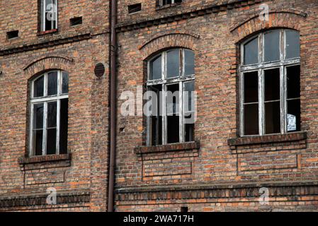 Facade of an old destroyed and abandoned factory. Stock Photo