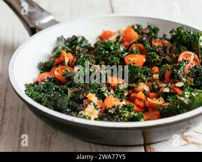 Pan with kale (var. Lippische Palme) and tomatoes. Stock Photo