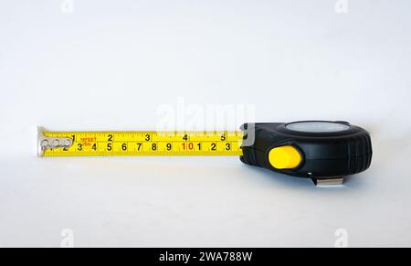 Self retracting metal measuring tape, isolated on white background Stock Photo