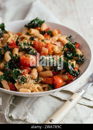 Kale (var. Lippische Palme), Pasta and White Beans in a bowl Stock Photo