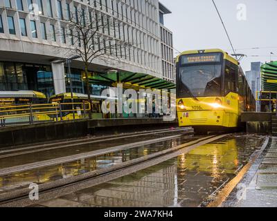 A vivid yellow tram pictured in St Peters Square station on the Manchester Metrolink transport network on 2 January 2024. Stock Photo