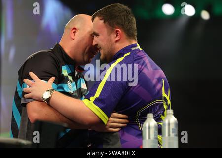 Luke Littler and Rob Cross after their semifinal during the BetMGM Premier League Darts Night 6