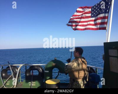 US military forces. 161004N0901-001 MEDITERRANEAN SEA- Seaman Austin George, assigned to Coastal Riverine Squadron FOUR (CRS-4), from Indianapolis, stands Anti-Terrorism watch overseeing small boat traffic while providing point defense for M/T OVERSEAS MYKONOS. Sailors assigned to CRS-4 are currently deployed for Embarked Security Team missions.  EST members, headquartered in Rota, Spain, are prepared to conduct missions in order to protect vital naval assets. (U.S. Navy photo by Petty Officer Third Class Christopher Correa/Released) Stock Photo
