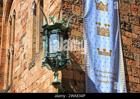The banner proudly displaying the ancestral home of the Percy family: Alnwick Castle, Northumberland, UK Stock Photo
