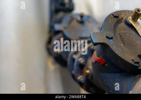 The interior of a mechanical room and a domestic potable water system with valves and connecting pipes. Stock Photo