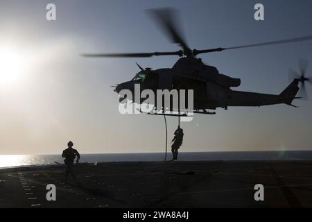 US military forces. 170401OC926-185 Mediterranean Sea (April 1, 2017) Marines with the Maritime Raid Force, 24th Marine Expeditionary Unit (MEU), fast-rope from a UH-1Y Venom helicopter aboard the amphibious transport dock ship USS Mesa Verde (LPD 19,) as they simulated boarding a vessel April 1, 2017. The 24th MEU is underway with the Bataan Amphibious Ready Group in support of maritime security operations and theater security cooperation efforts in the U.S. 6th Fleet area of operations. (U.S. Marine Corps photo by Cpl. Hernan Vidaña) Stock Photo