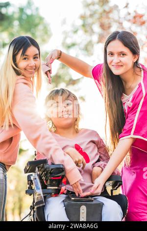 Inspire inclusion feminist equality and diversity heart love symbol. Group with cerebral palsy woman Stock Photo