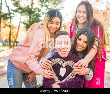 Inspire inclusion IWD2024, diversity with disability feminist group. Heart health hand symbol Stock Photo