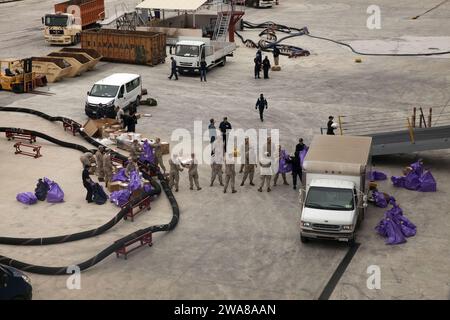 US military forces. 170404AS864-023 Souda Bay, Greece (April 4, 2017) Marines and Sailors with Combat Logistics Battalion 24 and the amphibious transport dock ship USS Mesa Verde (LPD 19) drop off mail from the ship in port during a mail call April 4, 2017. The 24th Marine Expeditionary Unit is underway with the Bataan Amphibious Ready Group in support of maritime security operations and theater security cooperation efforts in the U.S. 6th Fleet area of operations. (U.S. Marine Corps photo by Gunnery Sgt. Adaecus G. Brooks) Stock Photo