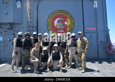 US military forces. 170514N0901-029 MEDITERRANEAN SEA (May 14, 2017) Mauritanian sailors, Turkish Naval Special Operations Forces and U.S. Army personnel pose for a group photo after conducting a simulated visit, board, search and seizure scenario aboard the Turkish Frigate TCG Gokceada (F-494) during exercise Phoenix Express 2017 off the coast of Cartagena, Spain in the Mediterranean Sea, May 14. Phoenix Express, sponsored by U.S. Africa Command and facilitated by U.S. Naval Forces Europe-Africa/U.S. 6th Fleet, is designed to improve regional cooperation, increase maritime domain awareness in Stock Photo