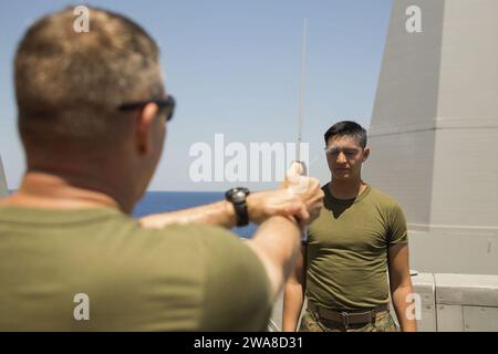 U.S. Marine Corps Cpl. Edgar R. Huff inspects a weapon at Montford ...