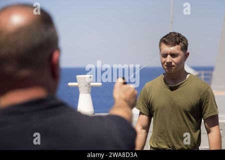 US military forces. 170520OC926-505 MEDITERRANEAN SEA (May 20, 2017) Lance Cpl. Jake Burbidge, assigned to Battalion Landing Team, 3rd Battalion, 6th Marine Regiment, 24th Marine Expeditionary Unit (MEU), is sprayed with oleoresin capsicum during a confidence course aboard the San Antonio-class amphibious transport dock ship USS Mesa Verde (LPD 19) May 20, 2017. The 24th MEU is underway with the Bataan Amphibious Ready Group in support of maritime security operations and theater security cooperation efforts in the U.S. 5th and U.S. 6th Fleet area of operations. (U.S. Marine Corps photo by Cpl. Stock Photo