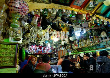 Azadegan Tea House - Chah Haj Mirza, one of the most famous tea house in Isfahan, Iran. The ceiling is decorated by lamps of various shapes and sizes Stock Photo