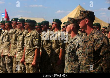 US military forces. 170710ZH288-004 SHIROKYI LAN, Ukraine (July 10, 2017)- U.S. Marines and Ukrainian marines stand together during the opening ceremony of exercise Sea Breeze 17 in Shirokyi Lan, Ukraine, July 10. Sea Breeze is a U.S. and Ukraine co-hosted multinational maritime exercise held in the Black Sea and is designed to enhance interoperability of participating nations and strengthen maritime security within the region.  (U.S. Marine Corps photo by Cpl. Sean J. Berry/Released) Stock Photo