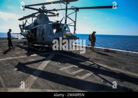 US military forces. 170927CK339-001 MEDITERRANEAN SEA (Sept. 27, 2017) – Marines assigned to Combined Anti-Armor Team, Battalion Landing Team, 1st Battalion 5th Marine Regiment, unload from a UH-1Y Huey during a tactical recovery of aircraft and personnel (TRAP) air familiarization drill aboard the San Antonio-class amphibious transport dock ship USS San Diego (LPD 22), Sept. 27,2017. The TRAP team specializes in quick, responsive recovery of downed aircraft, personnel and equipment. San Diego is deployed with the America Amphibious Ready Group and 15th Marine Expeditionary Unit to support mar Stock Photo