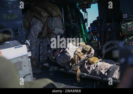 US military forces. 170927CK339-004  MEDITERRANEAN SEA (Sept. 27, 2017) – Marines assigned to the Combined Anti-Armor Team, Battalion Landing Team, 1st Battalion 5th Marine Regiment, load a stretcher into a UH-1Y Huey during a tactical recovery of aircraft and personnel (TRAP) air familiarization drill aboard the San Antonio-class amphibious transport dock ship USS San Diego (LPD 22), Sept. 27, 2017. The TRAP team specializes in quick responsive recovery of downed aircraft, personnel and equipment. San Diego is deployed with the America Amphibious Ready Group and 15th MEU to support maritime s Stock Photo
