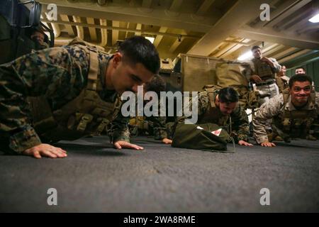 US military forces. 170929CK339-032 MEDITERRANEAN SEA (Sept. 29, 2017) –Cpl. David Galata, assigned to the 15th Marine Expeditionary Unit’s (MEU) Combat Logistics Battalion 15, does pushups while participating in a combat life savers(CLS) course aboard the San Antonio-class amphibious transport dock ship USS San Diego (LPD 22), Sept. 29, 2017. CLS hones the medical abilities of Marines to properly treat an injured Marine or Sailor while experiencing stress and fatigue. San Diego is deployed with the America Amphibious Ready Group and 15th MEU to support maritime security operations and theater Stock Photo