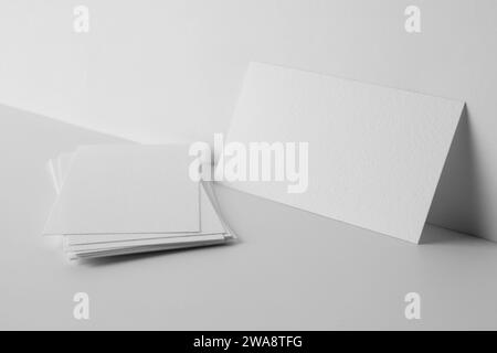 Blank business cards on white background. Mockup for design Stock Photo