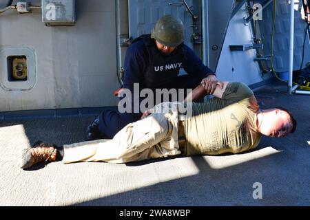 US military forces. 171019QR145-085 SOUDA BAY, Greece (Oct. 19, 2017)  Navy Counselor 1st Class Frederick Fulgencio, assigned to the Arleigh Burke-class guided-missile destroyer USS Porter (DDG 78), top, conducts a personnel inspection on a simulated active shooter, Chief Gunner's Mate Nick Walker, assigned to Afloat Training Group Norfolk, during an anti-terrorism force protection training inspection at Souda Bay, Greece Oct. 19, 2017. Porter, forward-deployed to Rota, Spain, is on its fourth patrol in the U.S. 6th Fleet area of operations in support of regional allies and partners, and U.S. Stock Photo