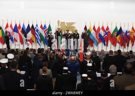 US military forces. 171020XT273-288 NAPLES, Italy (Oct. 20, 2017) Distinguished guests salute the American flag during  a change of command ceremony held at the Allied Joint Force Command auditorium in Naples, Italy, Oct. 20, 2017. During the ceremony, Adm. James Foggo III relieved Adm. Michelle Howard as commander, Allied Joint Force Command Naples and commander, U.S. Naval Forces Europe-Africa. U.S. Naval Forces Europe-Africa, headquartered in Naples, Italy, oversees joint and naval operations, often in concert with allied, joint, and interagency partners, to enable enduring relationships an Stock Photo
