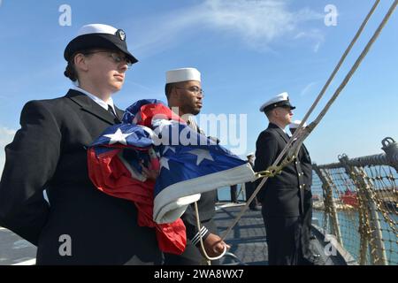 US military forces. 171027GL340-072 GAETA, Italy (Oct. 27, 2017) Ship’s Serviceman 2nd Class Sarah Brooks, left, and Ship’s Serviceman Seaman Alijah Parkerhardison, center, prepare to raise the American flag aboard the Blue Ridge-class command ship USS Mount Whitney (LCC 20) as the ship arrives in its forward-deployed port of Gaeta, Italy Oct. 27, 2017. Mount Whitney is returning to Gaeta following a 10-month maintenance period at Viktor Lenac shipyard in Rijeka, Croatia. Mount Whitney, forward-deployed to Gaeta, operates with a combined crew of U.S. Navy Sailors and Military Sealift Command c Stock Photo