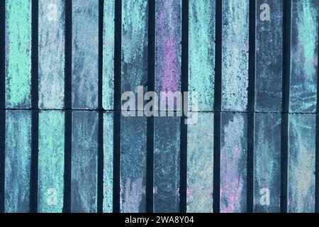 Horizontal photo of a stone wall. Abstract background from a wall painted with crayons. Stock Photo