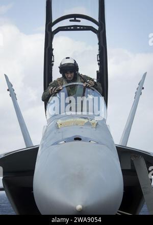 US military forces. 180113TF680-0724 ATLANTIC OCEAN (Jan. 13, 2018) Lt. John Bauman, assigned to the 'Black Lions' of Strike Fighter Squadron  (VFA) 213, climbs inside an F/A18F Super Hornet during flight operations aboard the USS Gerald R. Ford (CVN 78). Ford is underway conducting test and evaluation operations. (U.S. Navy photo by Mass Communication Specialist 3rd Class Ryan Carter/Released) Stock Photo
