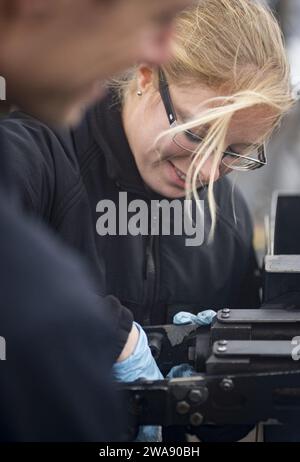 US military forces. 180122RG482-539 ATLANTIC OCEAN (Jan. 22, 2018) Fire Controlman 2nd Class Sarah Welch performs maintenance on a .50-caliber machine gun aboard the Arleigh Burke-class guided-missile destroyer USS Ross (DDG 71) Jan. 22, 2018. Ross, forward-deployed to Rota, Spain, is on its sixth patrol in the U.S. 6th Fleet area of operations in support of regional allies and partners and U.S. national security interests in Europe. (U.S. Navy photo by Mass Communication Specialist 1st Class Kyle Steckler/Released) Stock Photo