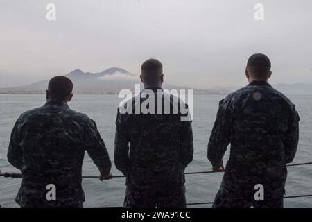 US military forces. 180304QR145-043 NAVAL SUPPORT ACTIVITY NAPLES, Italy (March 4, 2018)  Sailors aboard the Blue Ridge-class command and control ship USS Mount Whitney (LCC 20) look at Mount Vesuvius while departing Naval Support Activity Naples, Italy, March 4, 2018. Mount Whitney arrived in Naples, Italy Feb. 25, 2018 to take part in the U.S. 6th Fleet and Naval Striking and Support Forces NATO change of command. (U.S. Navy photo by Mass Communication Specialist 3rd Class Krystina Coffey/ Released) Stock Photo