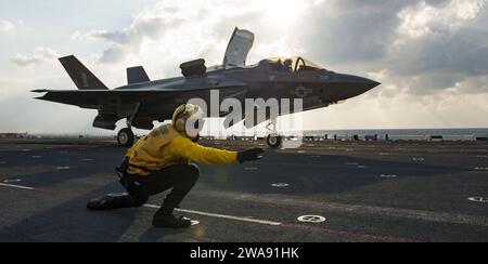 US military forces. 180309BD308-2019  EAST CHINA SEA (Mar. 9, 2018) Aviation Boatswain's Mate 3rd Class Donovan Hampton launches an F-35B off the flight deck of the amphibious assault ship USS Wasp (LHD 1) as part of a routine patrol in the Indo-Pacific region. Pilots with the 'Green Knights' of Marine Fighter Attack Squadron 121 (VMFA-121), assigned under the Okinawa-based 31st Marine Expeditionary Unit, are scheduled to conduct a series of qualification flights on Wasp over a multi-day period. The Wasp Expeditionary Strike Group is conducting a regional patrol meant to strengthen regional al Stock Photo