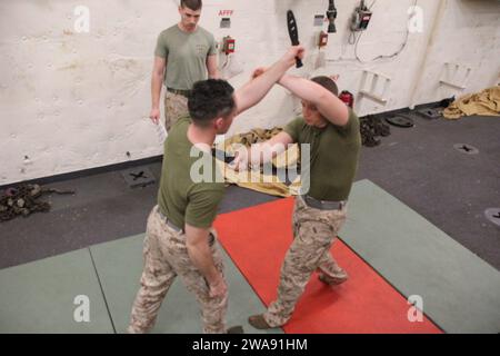 US military forces. 180309DL117-0015 MEDITERRANEAN SEA (March 9, 2018) Marine Lance Cpl. Logan Terry, right, a mortarman assigned to Battalion Landing Team, 2nd Battalion, 6th Marine Regiment, 26th Marine Expeditionary Unit (MEU), conducts a counter to forward strike technique on Marine Lance Cpl. Justin Heimbach, a mortarman with the unit, during a Marine Corps Martial Arts Program (MCMAP) green belt advancement class aboard the San Antonio-class amphibious transport dock USS New York (LPD 21) March 9, 2018. MCMAP teaches Marines techniques they can utilize in hand-to-hand combat to increase Stock Photo