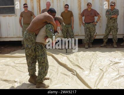 US military forces. 180313FD185-6176 CAMP LEMONNIER, Djibouti (March 13, 2018) Hospital Corpsman 1st Class Kurt Warakomski, front right, a member of Task Group (TG) 68.6, demonstrates a hawes carry as part of a tactical casualty combat care class that teaches Sailors how to treat and care for casualties in multiple phases of combat. TG 68.6 is forward-deployed to the U.S. 6th Fleet area of operations and conducts joint and naval operations, often in concert with allied and interagency partners, in order to advance U.S. national interests and security and stability in Europe and Africa. (U.S. N Stock Photo