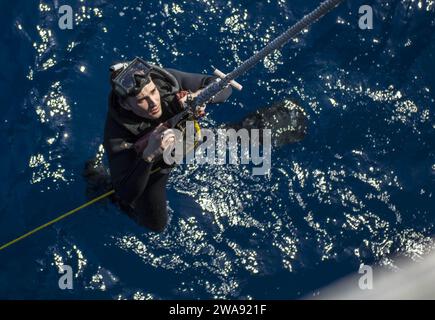 US military forces. 180314KA046-0015  MEDITERRANEAN SEA (March 14, 2018) – Gas Turbine Systems Technician (Electrical) 2nd Class Kyle Brown is lowered into the water during search and rescue swimmer training aboard the Arleigh Burke-class guided-missile destroyer USS Carney (DDG 64), in the Mediterranean Sea, March 14, 2018. Carney, forward-deployed to Rota, Spain, is on its fourth patrol in the U.S. 6th Fleet area of operations in support of regional allies and partners, and U.S. national security interests in Europe and Africa. (U.S. Navy photo by Mass Communication Specialist 2nd Class Jame Stock Photo