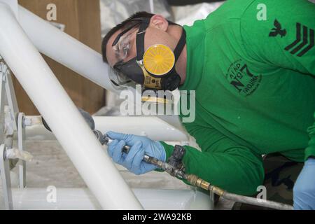 US military forces. 180325ZG607-0051 MEDITERRANEAN SEA (March 25, 2018) Aircraft Structural Mechanic 1st Class Travis Lowe paints a blade stand to prevent corrosion aboard the Wasp-class amphibious assault ship USS Iwo Jima (LHD 7) March 25, 2018. Iwo Jima, homeported in Mayport, Florida, is conducting naval operations in the U.S. 6th Fleet area of operations. (U.S. Navy photo by Mass Communication Specialist Seaman Dominick A. Cremeans/Released) Stock Photo