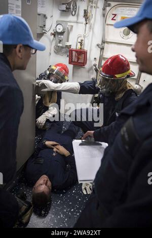 US military forces. 180330KP946-283 MEDITERRANEAN SEA  (March 30, 2018) Sailors do first aid on a simulated casualty during a general quarters drill aboard the Arleigh Burke-class guided-missile destroyer USS Donald Cook (DDG 75) March 30, 2018.  Donald Cook, forward-deployed to Rota, Spain, is on its seventh patrol in the U.S. 6th Fleet area of operations in support of regional allies and partners, and U.S. national security interests in Europe and Africa. (U.S. Navy photo by Mass Communication Specialist 2nd Class Alyssa Weeks / Released) Stock Photo