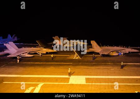 US military forces. 180416LI081-009  PACIFIC OCEAN (April 16, 2018) Three F/A-18F Super Hornets assigned to the 'Black Aces' of Strike Fighter Squadron (VFA) 41 prepare for night flight operations aboard the aircraft carrier USS John C. Stennis (CVN 74). John C. Stennis is underway with Carrier Air Wing (CVW) 9 conducting routine training as well as tailored ships training availability and final evaluation problem. (U.S. Navy photo by Mass Communication Specialist 3rd Class Joseph L. Miller/Released) Stock Photo