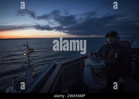 US military forces. 180428JI086-084 NAVAL STATION ROTA, Spain (April 28, 2018) Personnel Specialist 3rd Class Damian Johnson, assigned to the Arleigh Burke-class guided-missile destroyer USS Porter (DDG 78), stands watch on the bridge as the ship arrives at Naval Station Rota, Spain, to refuel April 28, 2018. Porter, forward-deployed to Rota, Spain, is on its fifth patrol in the U.S. 6th Fleet area of operations in support of U.S. national security interests in Europe and Africa. (U.S. Navy photo by Mass Communication Specialist 3rd Class Ford Williams/Released) Stock Photo