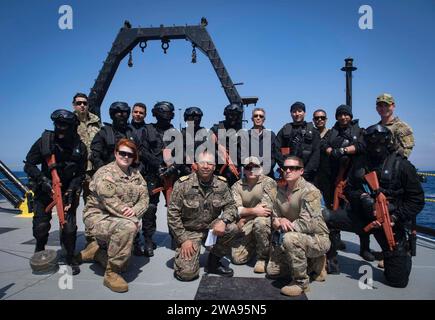 US military forces. 180506UY653-301  MEDITERRANEAN SEA (May 6, 2018) Members of the U.S. Army, U.S. Navy, U.S. Coast Guard, Royal Moroccan Navy and Tunisian Navy pose for a photo following visit, board, search and seizure training aboard the Tunisian Navy MNT Khaireddine during exercise Phoenix Express 2018. Phoenix Express is sponsored by U.S. Africa Command and facilitated by U.S. Naval Forces Europe-Africa/U.S. 6th Fleet, and is designed to improve regional cooperation, increase maritime domain awareness information sharing practices, and operational capabilities to enhance efforts to achie Stock Photo