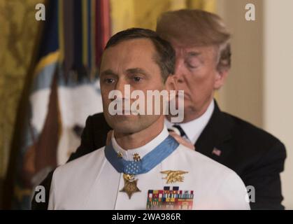 US military forces. 180524BB269-003 WASHINGTON (May 24, 2018) President Donald J. Trump presents the Medal of Honor to retired Master Chief Special Warfare Operator (SEAL) Britt Slabinski during a ceremony at the White House in Washington, D.C. Slabinski received the Medal of Honor for his actions during Operation Anaconda in Afghanistan in March 2002. (U.S. Navy photo by Mass Communication Specialist 1st Class Raymond D. Diaz III/Released) Stock Photo