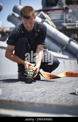 US military forces. 180607JI086-012 MEDITERRANEAN SEA (June 7, 2018) Personnel Specialist 3rd Class Damien Johnson, assigned to the Arleigh Burke-class guided-missile destroyer USS Porter (DDG 78), lays out a firehose during a flight deck firefighting drill, June 7, 2018. Porter, forward-deployed to Rota, Spain, is on its fifth patrol in the U.S. 6th Fleet area of operations in support of U.S. national security interests in Europe and Africa. (U.S. Navy photo by Mass Communication Specialist 3rd Class Ford Williams/Released) Stock Photo