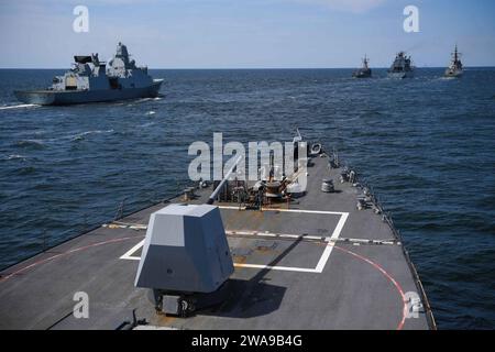 US military forces. 180609FP878-090 BALTIC SEA (June 9, 2018) The Arleigh Burke-class guided-missile destroyer USS Bainbridge (DDG 96), bottom, lines up with other ships participating in exercise Baltic Operations (BALTOPS) 2018 to conduct a refueling at sea with the Berlin class German replenishment ship Frankfurt am Main (A 1412) June 9. BALTOPS is the premier annual maritime-focused exercise in the Baltic Region and one of the largest exercises in Northern Europe enhancing flexibility and interoperability among allied and partner nations. (U.S. Navy photo by Mass Communication Specialist 1s Stock Photo