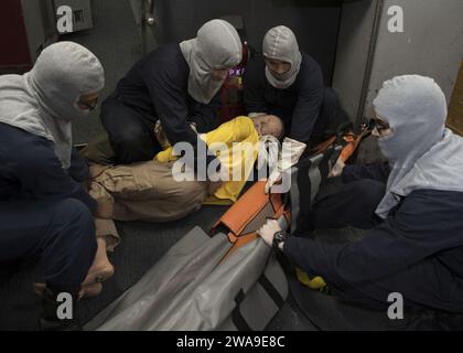 US military forces. 180630GY005-0014 ATLANTIC OCEAN (June 30, 2018) Stretcher bearers practice patient moving techniques during a general quarters drill aboard the Nimitz class aircraft carrier USS Harry S. Truman (CVN 75). Harry S. Truman is currently deployed as part of an ongoing rotation of U.S. forces supporting maritime security operations in international waters around the globe. (U.S. Navy photo by Mass Communication Specialist 3rd Class Gitte Schirrmacher/Released) Stock Photo